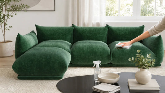 Green chenille sectional sofa with cleaning cloth and spray bottle, showing how to clean chenille couch stains safely.