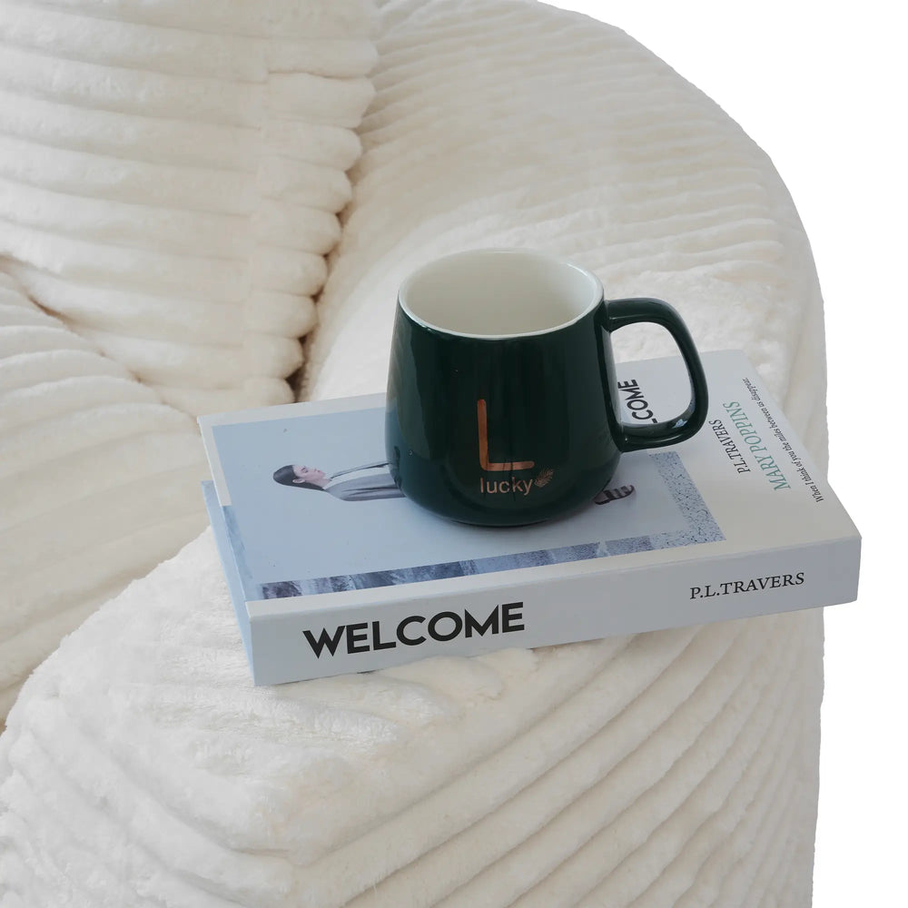 Sofás Essential Round Boneless | Sofá individual de una plaza en tela afelpada beige