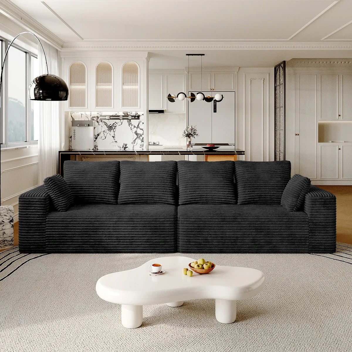 a picture of a black boneless sofa and a coffee table in a living room
