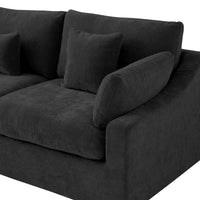 Armrest and seat cushions on a black Deluxe Cloud sofa