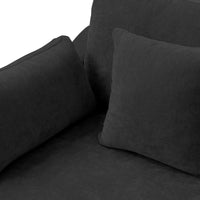 Armrest pillow on a black Deluxe Cloud sofa