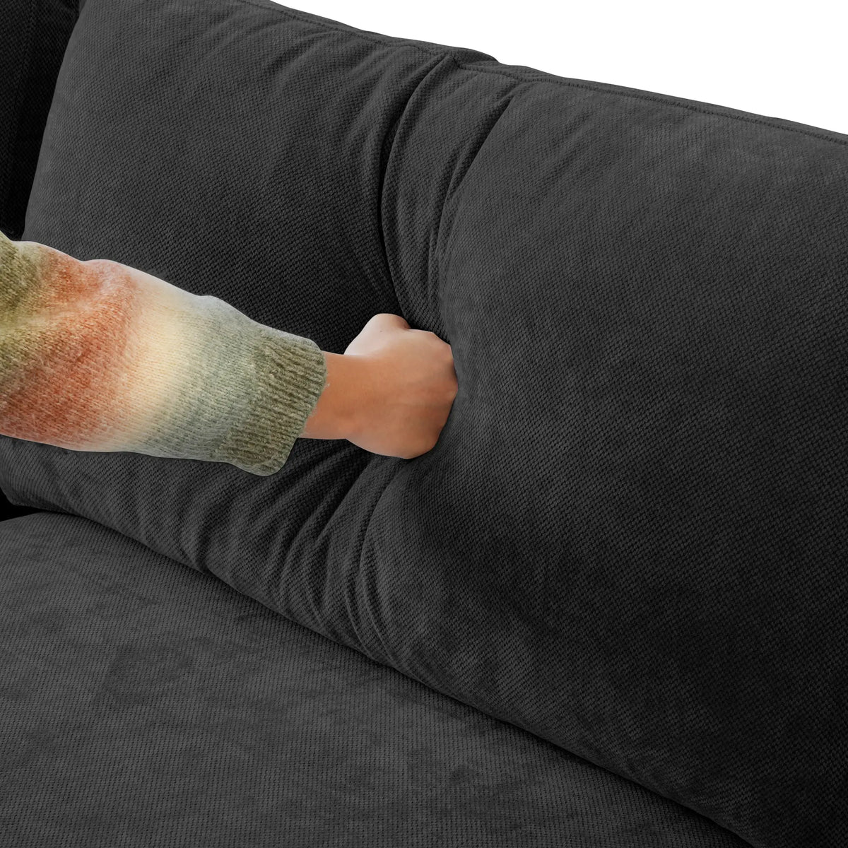Back cushion pressed by hand on a black Deluxe Cloud sofa
