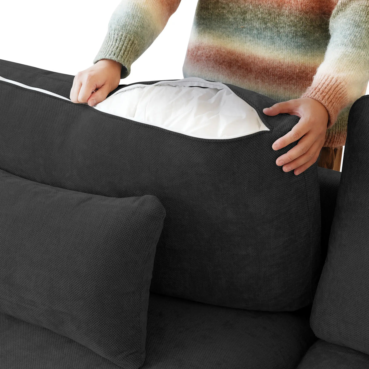 Zippered back cushion cover on a black Deluxe Cloud sofa